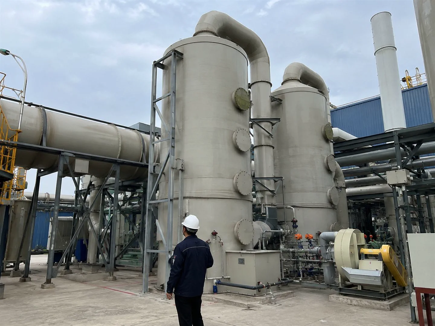 Vertical adsorption vessels and ducting in an industrial gas-treatment system