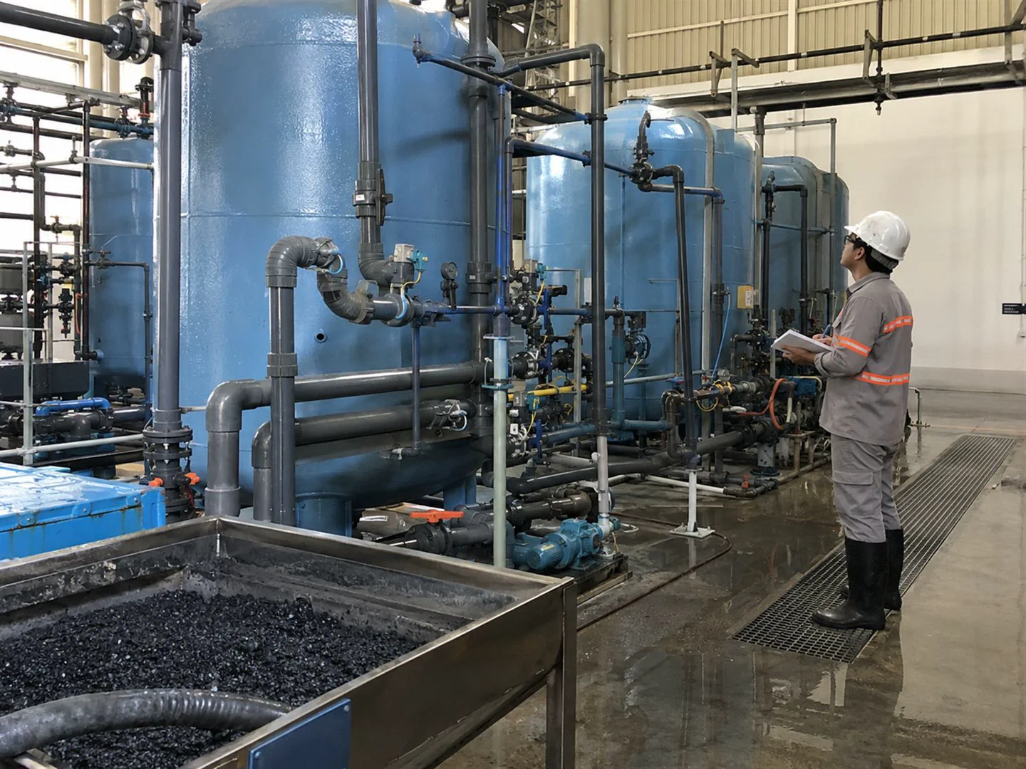 Activated carbon filtration vessels and piping in a water-treatment system
