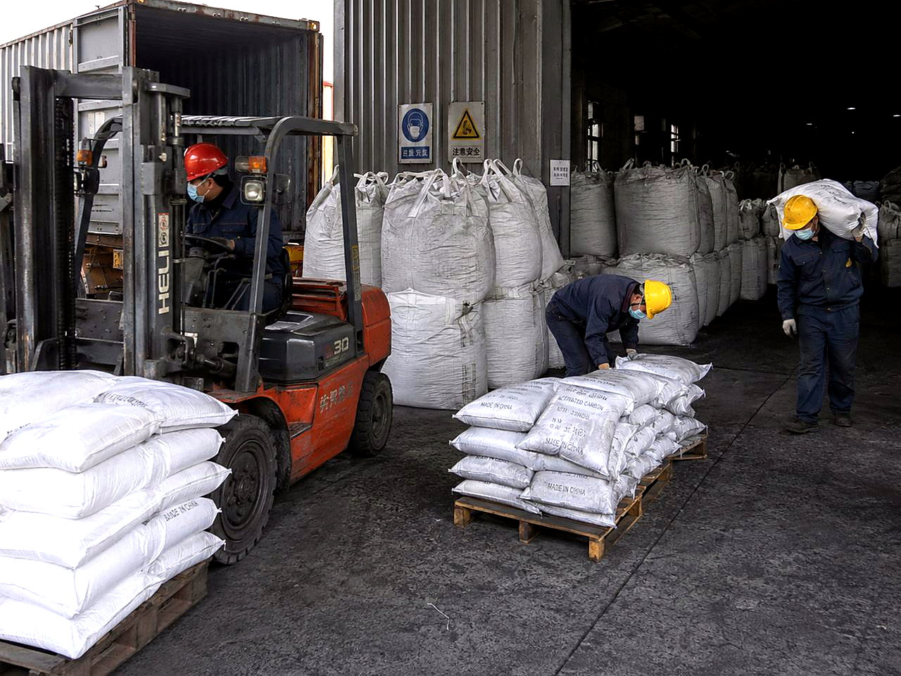 Activated carbon export packing and loading area with bags and forklift