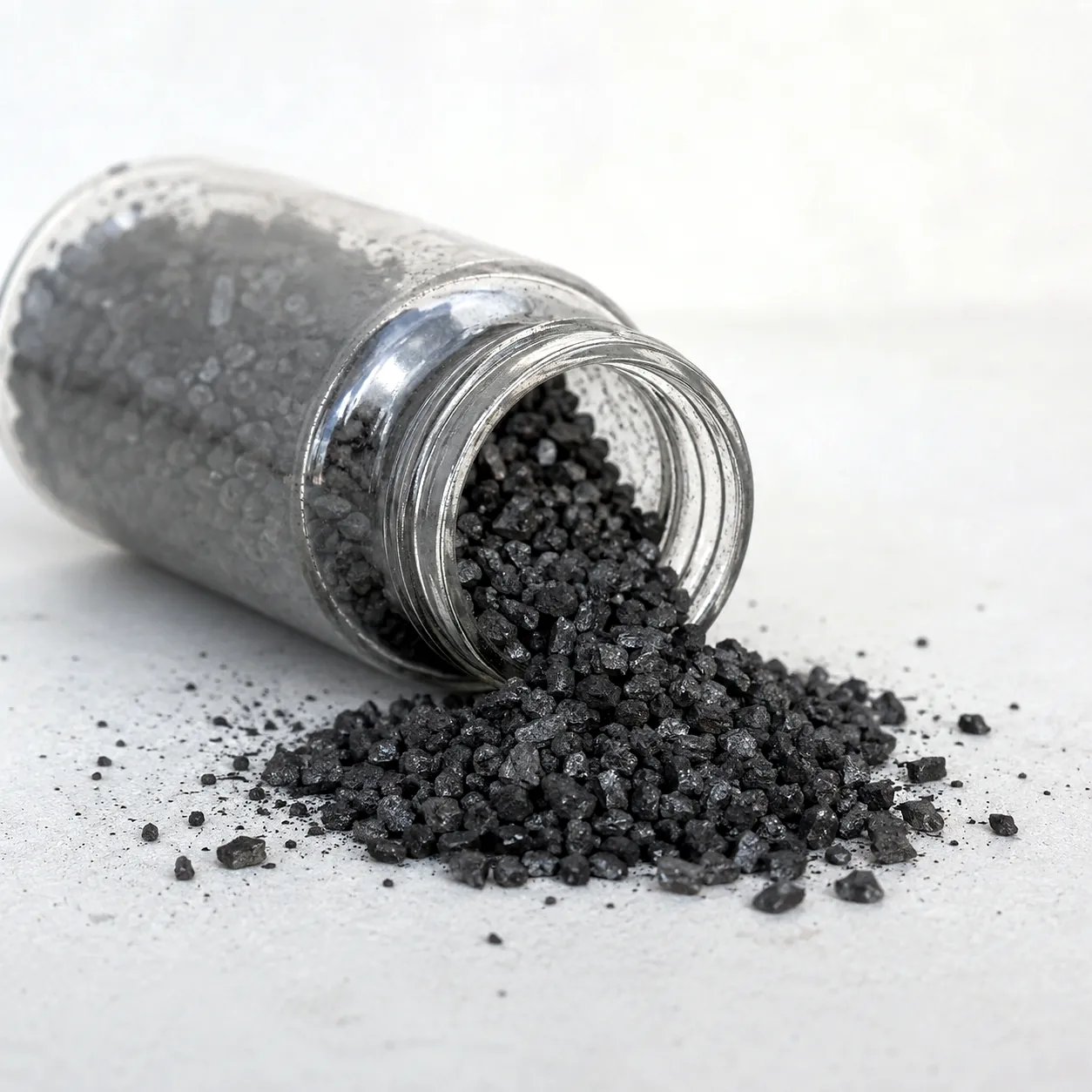 Coal based granular activated carbon in a glass jar