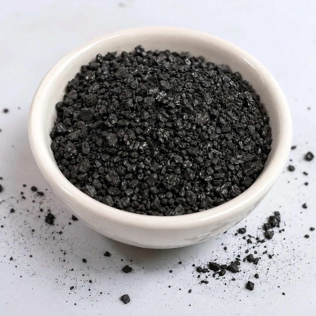 Coal based granular activated carbon in a ceramic bowl