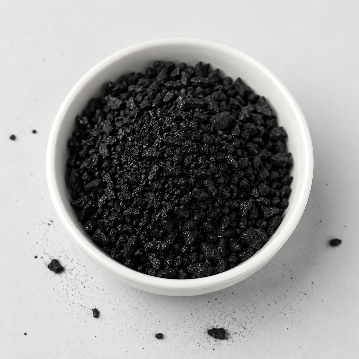 Coconut shell granular activated carbon in a ceramic bowl